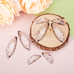 Set di ciondoli con strass rosa chiaro in resina trasparente&nbsp;RESI-TAC0002-47A