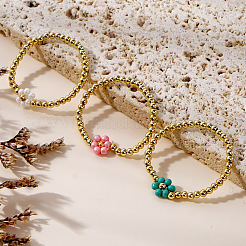 Ensemble de 3 bracelet extensible rond en laiton avec perles et fleurs en verre bicolores ([1] pièce).&nbsp;FH6392