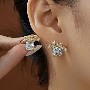 Серьги-гвоздики с бантом из латуни с прозрачным кубическим цирконием IO3713-1