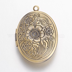 Colgantes de latón medallón, ovalada con flores, cepillado de bronce antiguo, 33x23.5x7mm, agujero: 1.5 mm