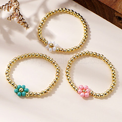 Ensemble de 3 bracelet extensible rond en laiton avec perles et fleurs en verre bicolores ([1] pièce).&nbsp;FH6392